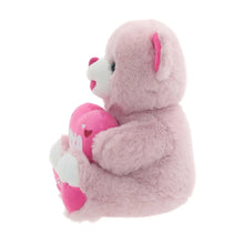 Pink teddy bear plush side view hugging heart with XOXO and 2026 paw patch